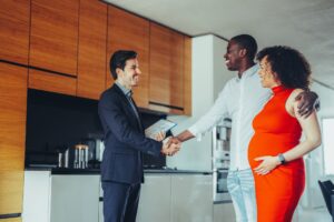 A couple of clients with a real estate agent.